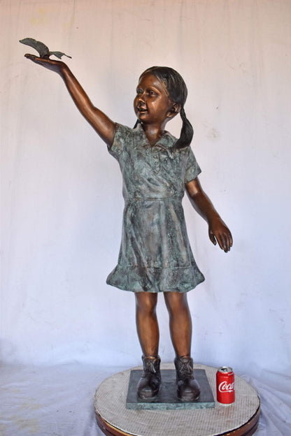 Young Girl Holding a Butterfly Outside at The Park - Size: 21"L x 11"W x 49"H