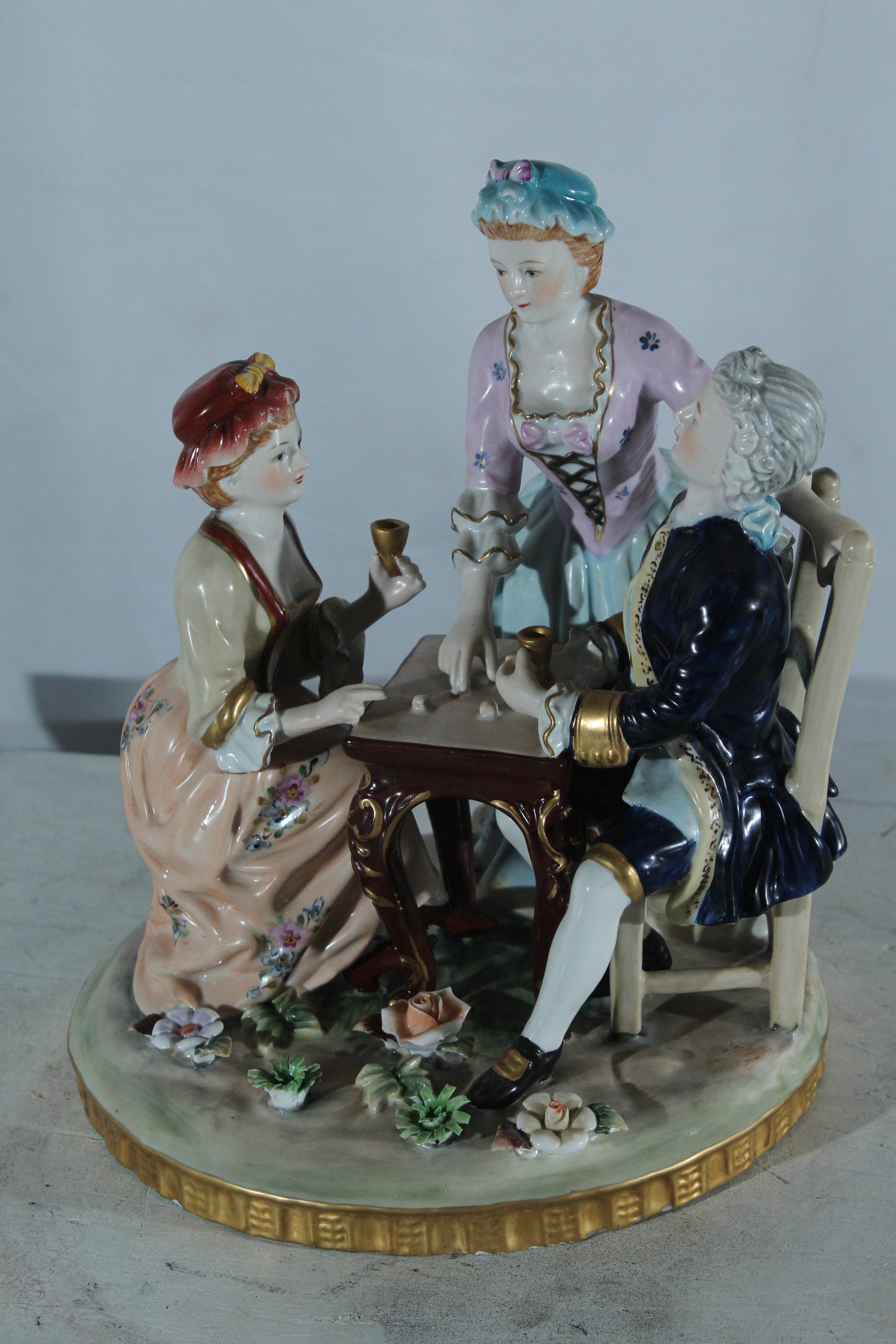 NIFAO Porcelain Figurine Group at Table with Cups 10"x10"x13"H