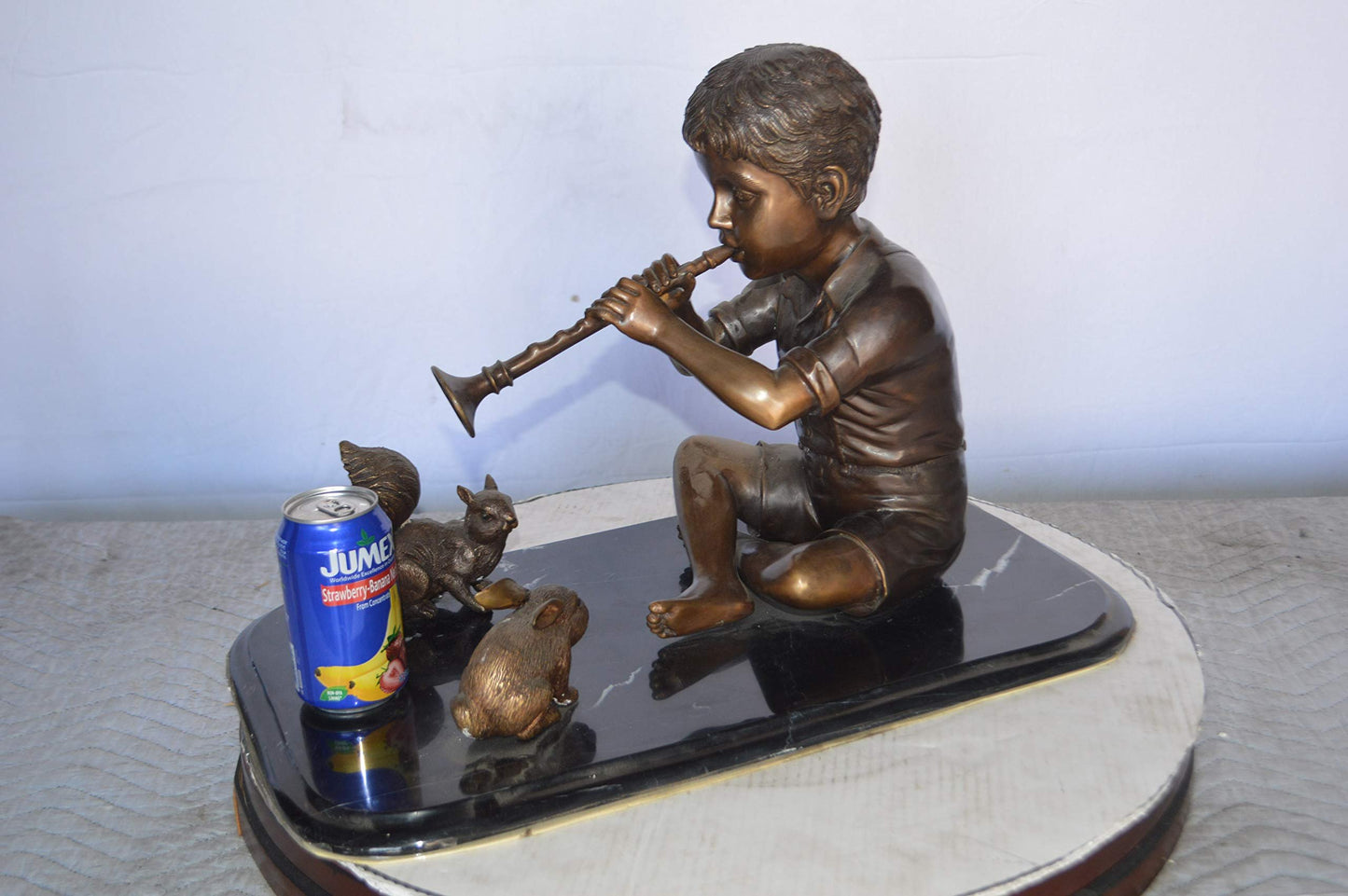 Boy With Rabbit And Squirrel Bronze Statue -  Size: 22"L x 13"W x 16"H.