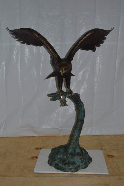 Eagle on a Tree Branch Bronze Statue -  Size: 44"L x 50"W x 65"H.