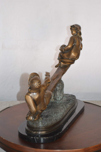 Boys Playing Seesaw on a Marble Base Bronze Statue -  Size: 22"L x 8"W x 17"H.