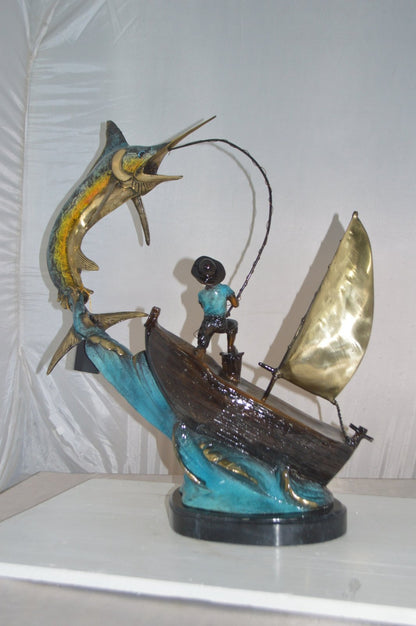 Old Man Fishing a Large Catch Bronze Statue -  Size: 27"L x 13"W x 30"H.