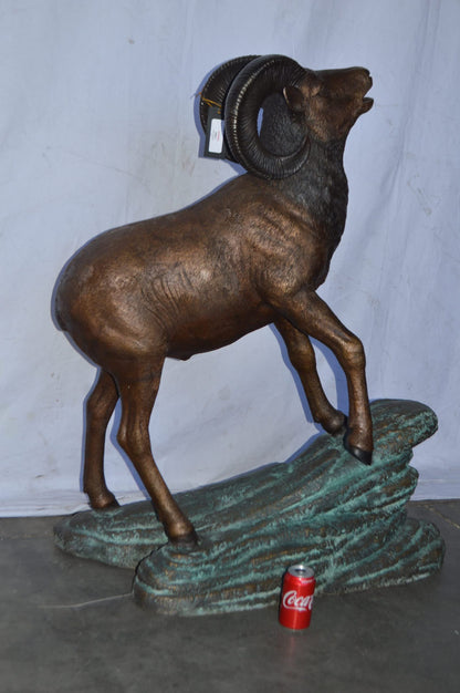 Life Size Ram standing on a rock Bronze Statue - Size: 38"L x 19"W x 45"H.