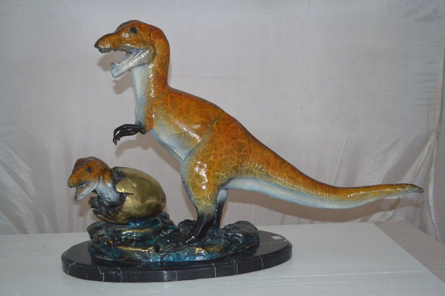 Dinosaur and baby Dino Bronze Statue -  Size: 26"L x 11"W x 18"H.
