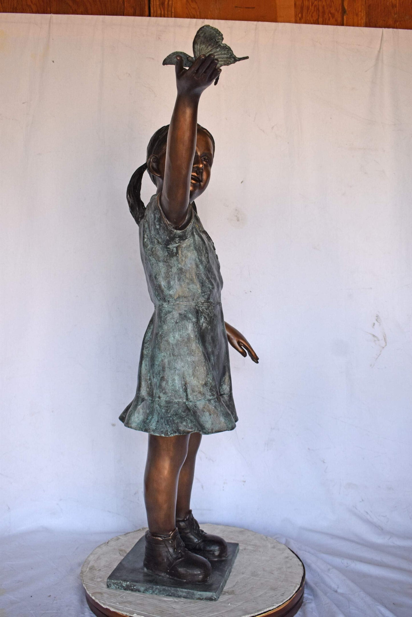 Young Girl Holding a Butterfly Outside at The Park - Size: 21"L x 11"W x 49"H