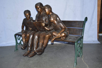 Mom and boys reading stories on bench bronze statue - Size: 53"L x 33"W x 39"H.