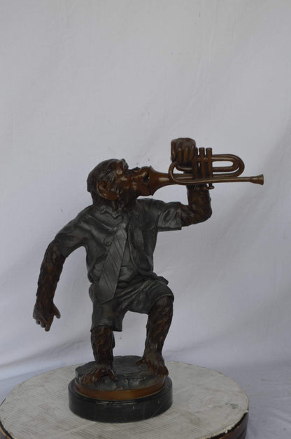 Monkey With Trumpet Bronze Statue - Size: 24"L x 12"W x 26"H.