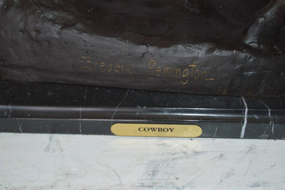Remington Cowboy on marble Bronze Statue -  Size: 24"L x 9"W x 23"H.