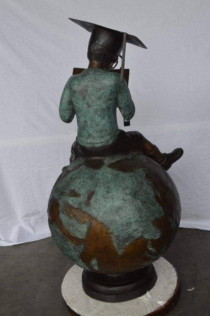 Student learning on top of world bronze statue -  Size: 28"L x 24"W x 52"H.