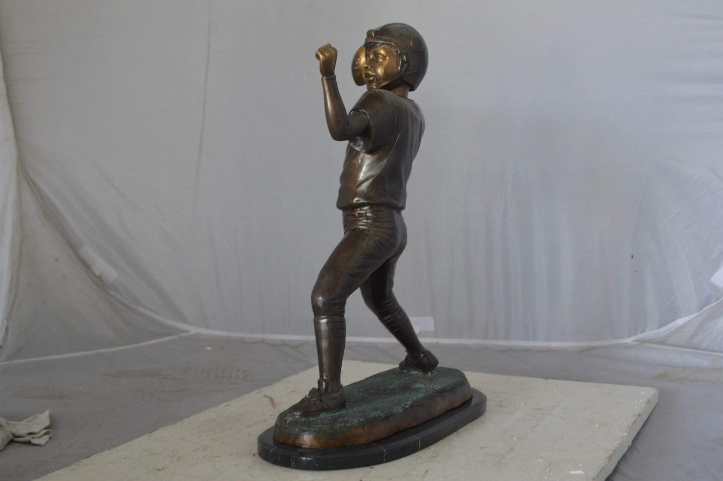 Young Quarterback bronze statue - Size: 14"L x 6"W x 20"H.