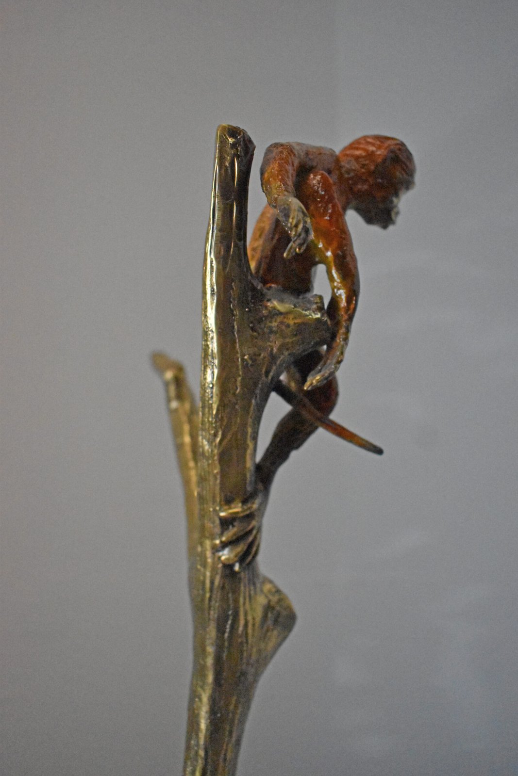 Colored Monkey Resting on a Tree Bronze Statue - Size: 12"L x 13"W x 27"H.