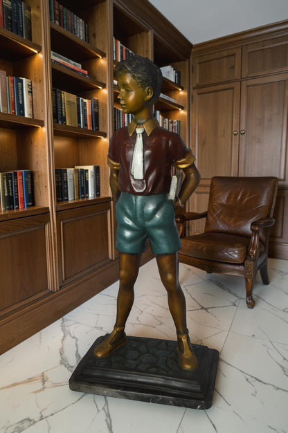 Kid Holding a Book Bronze Statue -  Size: 18"L x 11"W x 36"H.