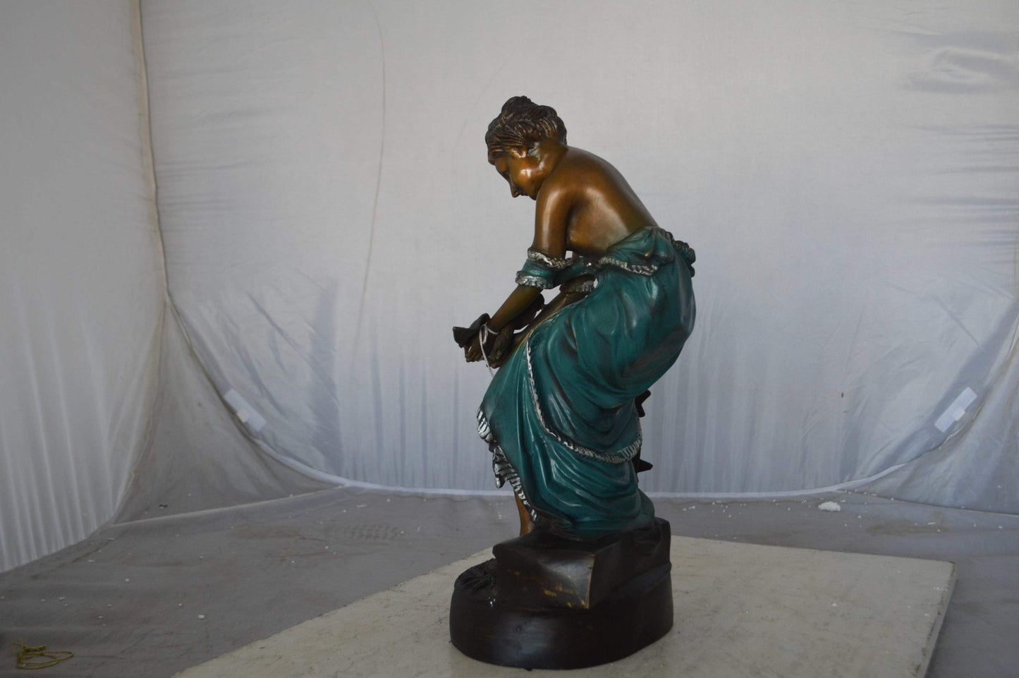Lady holding a bird bronze statue - Size: 10"L x 9"W x 20"H.