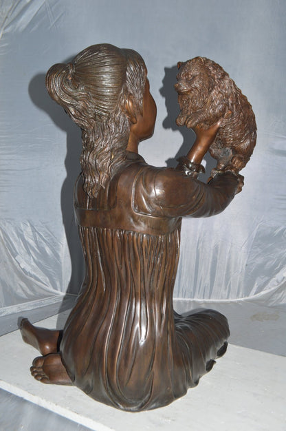 Girl Playing With Her Little Dog Bronze Statue -  Size: 22"L x 22"W x 30"H.