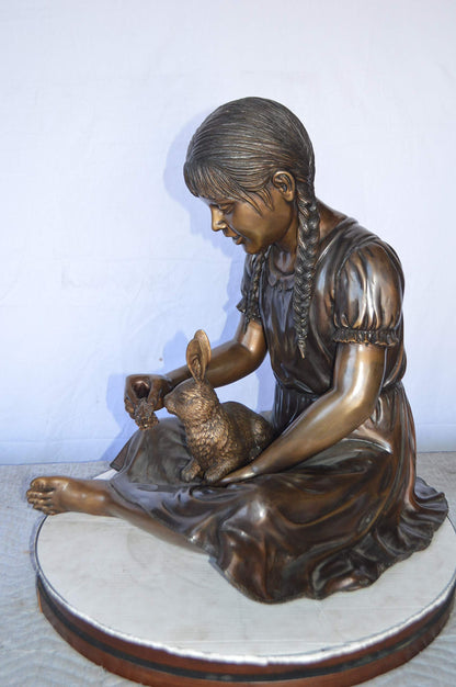 Sandra Sitting With Her Rabbit Bronze Statue -  Size: 25"L x 18"W x 25"H.