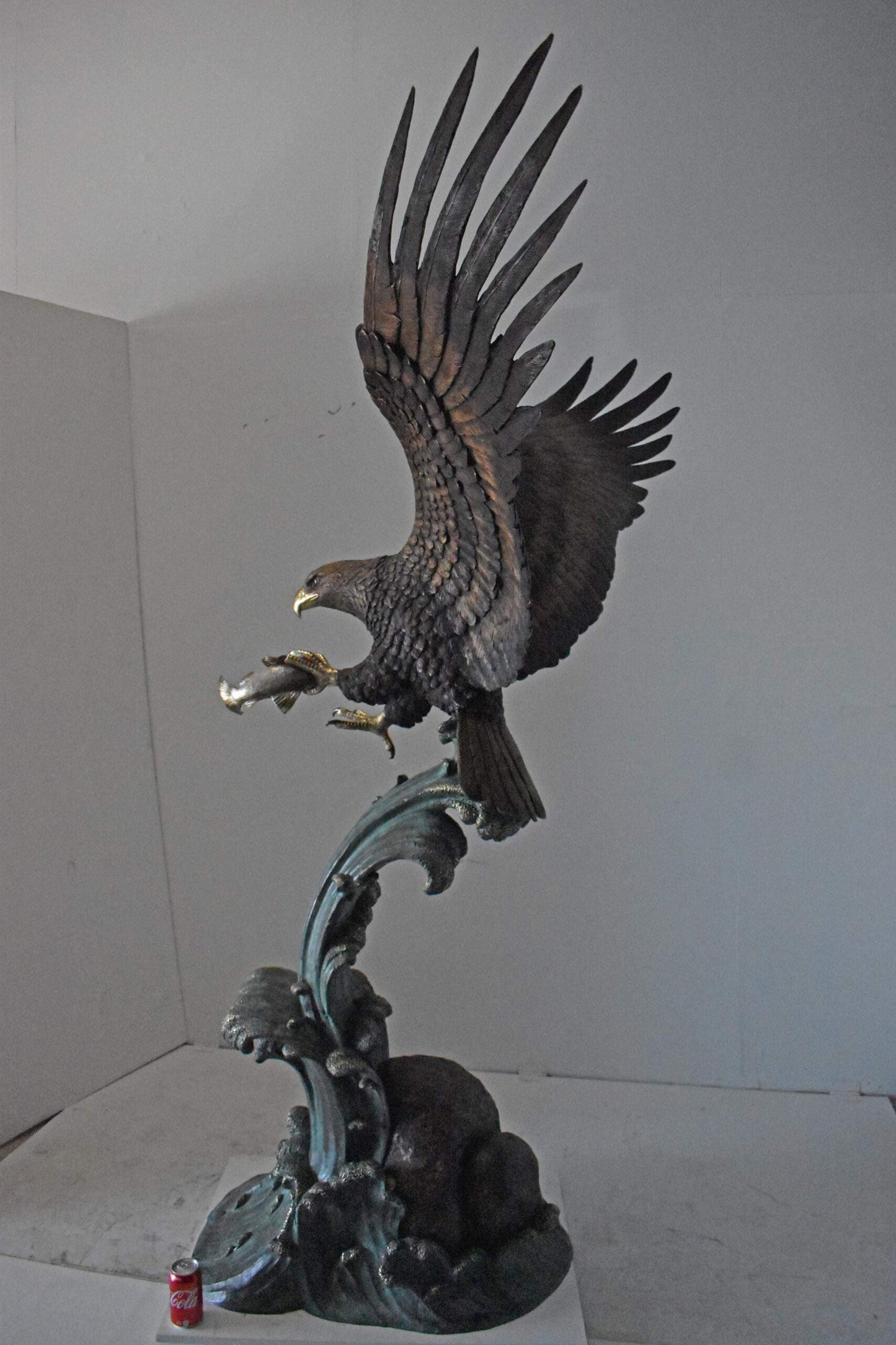 Eagle in Action Catching His Prey Bronze Statue - Size: 68"L x 40"W x 87"H.