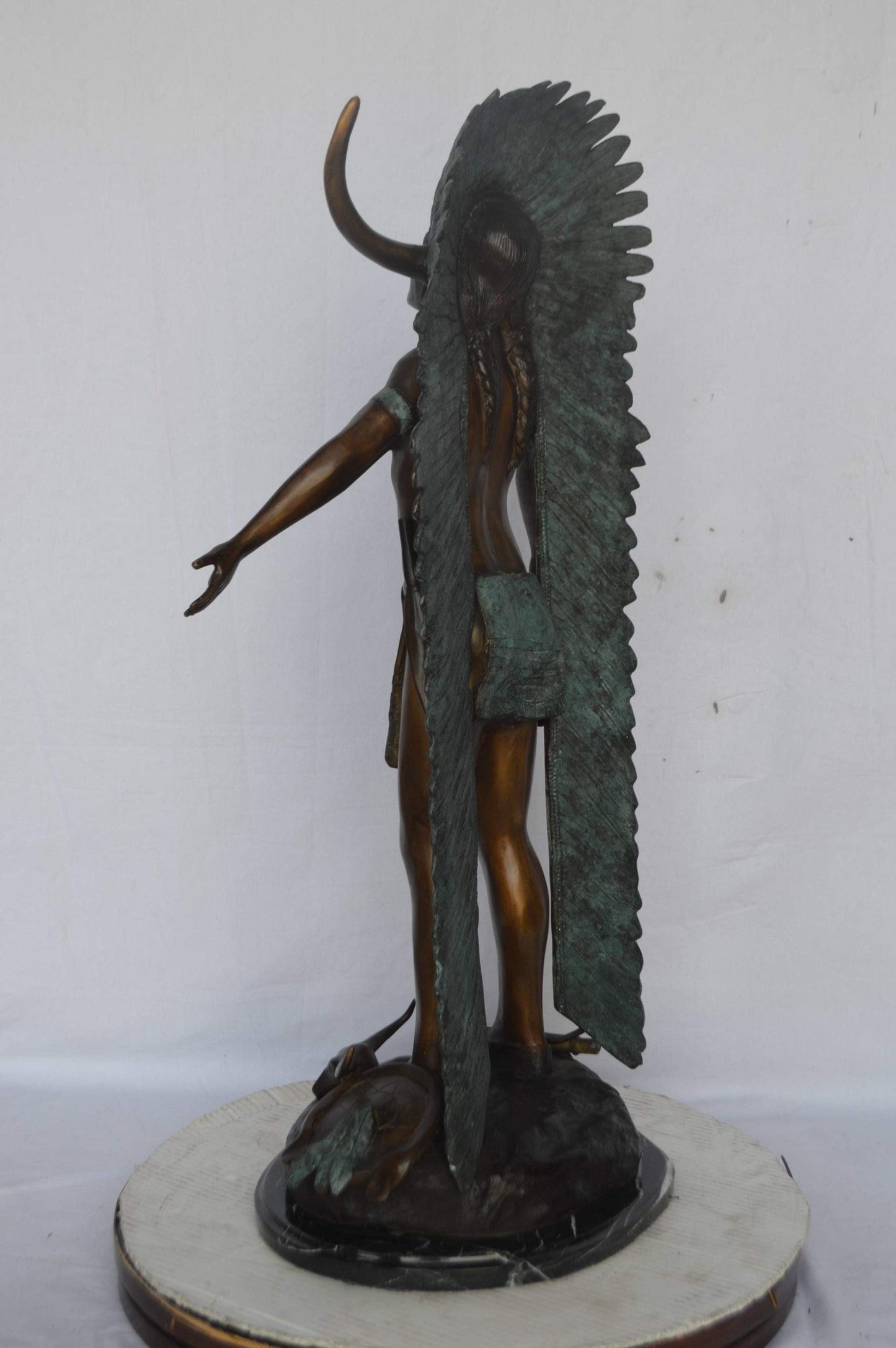 Indian with Plume bronze statue - Size: 22"L x 14"W x 38"H.