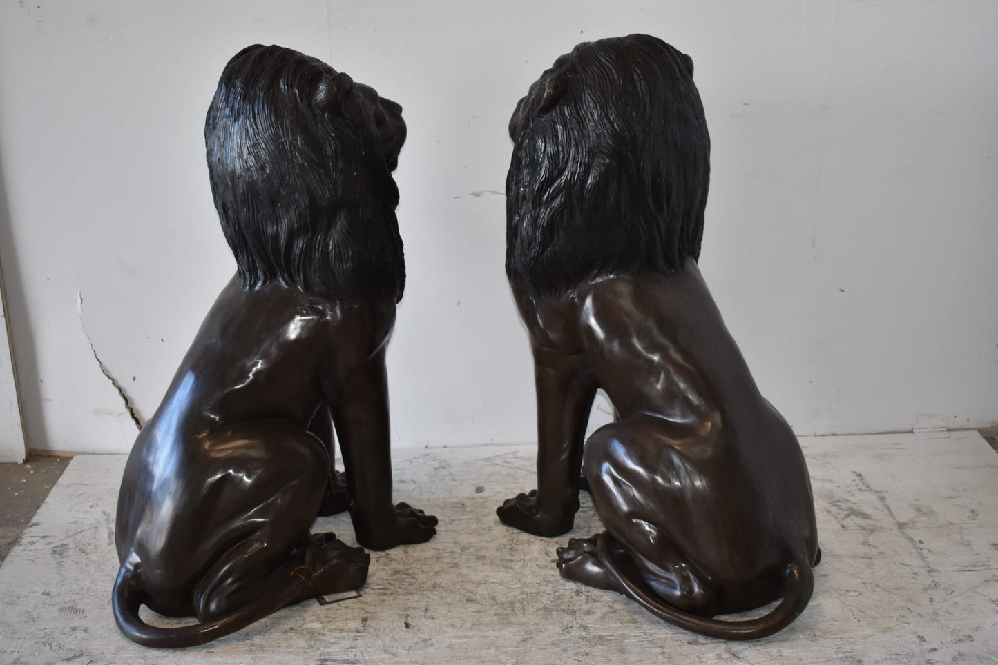 A Pair of Large Lions Sitting Side by Side Bronze Statues Size: 23" x 33" x 46"H