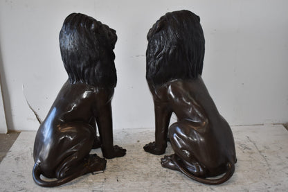 A Pair of Large Lions Sitting Side by Side Bronze Statues Size: 23" x 33" x 46"H