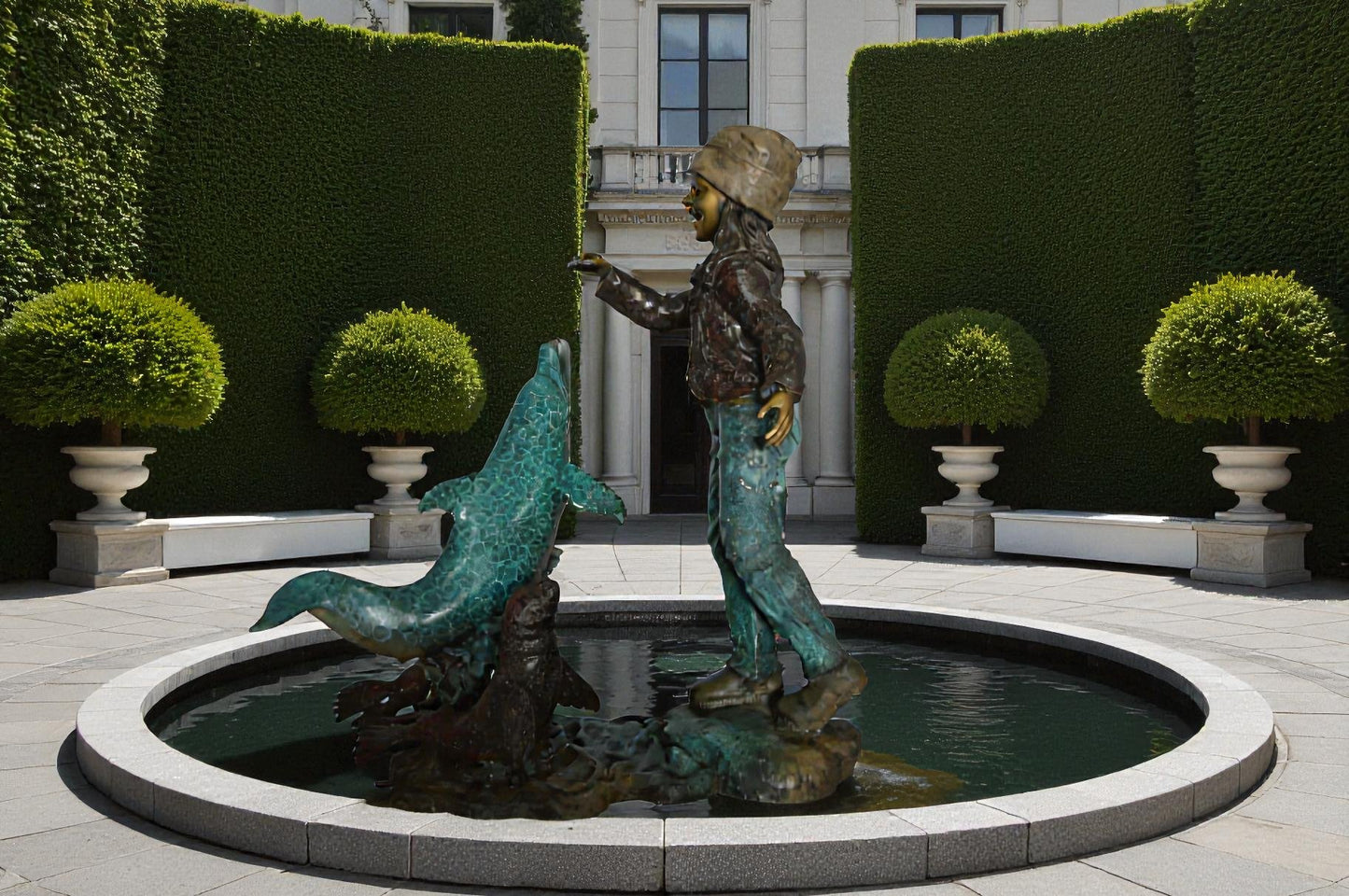 Girl feeding a dolphin and seals bronze fountain -  Size: 28"L x 17"W x 37"H.