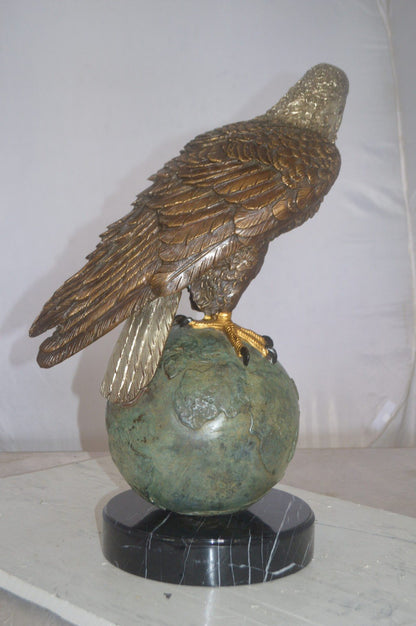 Bald Eagle Standing on a Globe Bronze Statue -  Size: 17"L x 9"W x 23"H.