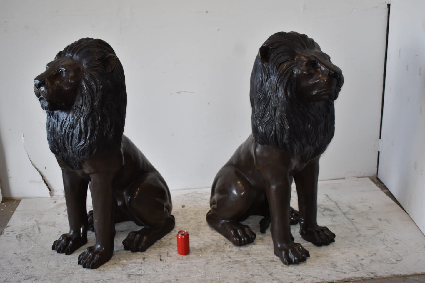 A Pair of Large Lions Sitting Side by Side Bronze Statues Size: 23" x 33" x 46"H