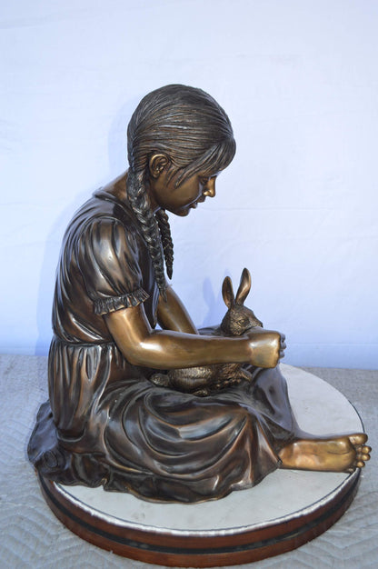 Sandra Sitting With Her Rabbit Bronze Statue -  Size: 25"L x 18"W x 25"H.