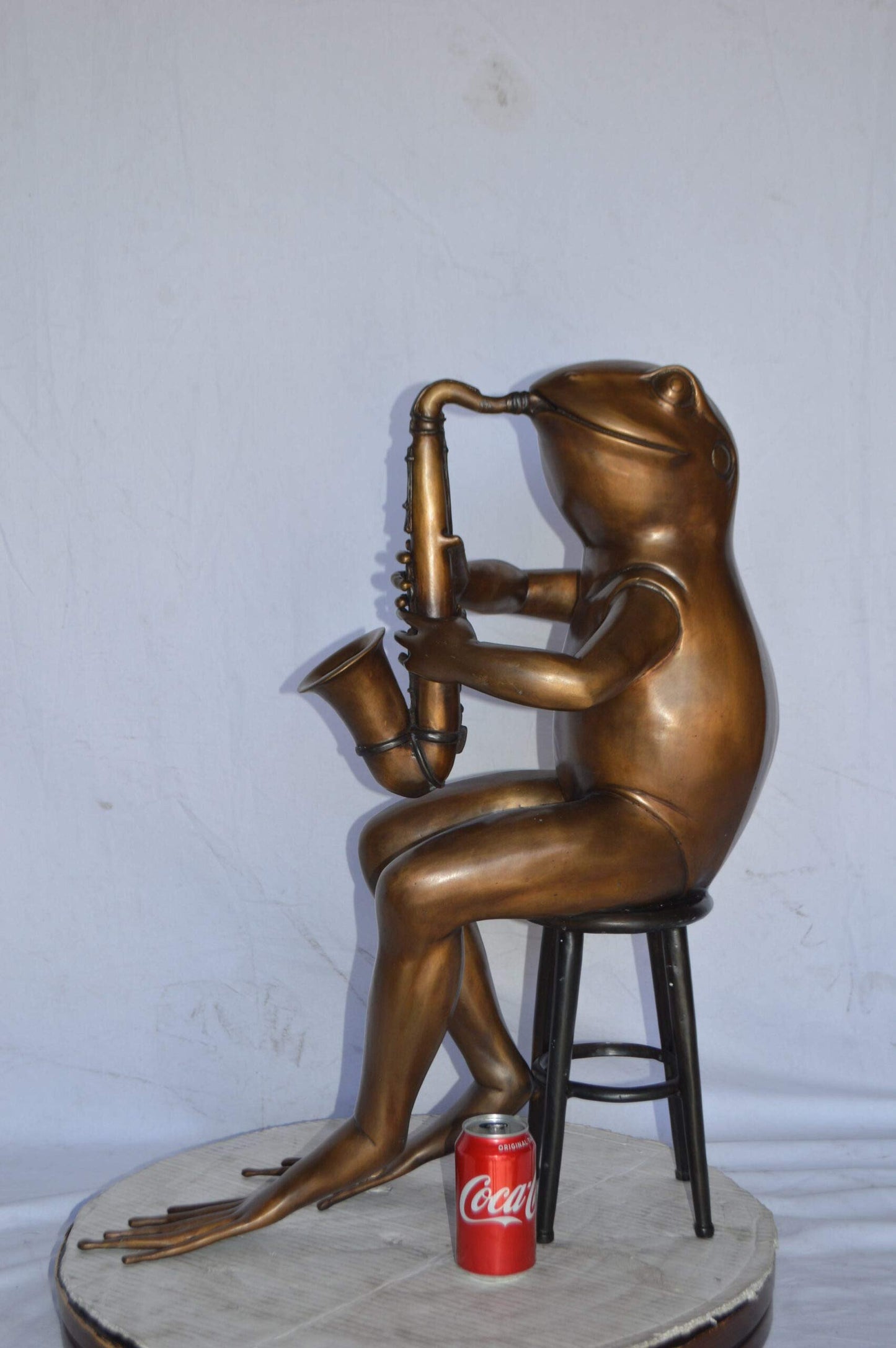 Frog playing saxophone bronze statue - Size: 23"L x 15"W x 30"H.