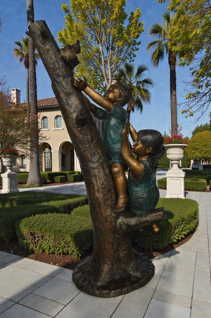 Children reaching up tree for a cat bronze statue -  Size: 24"L x 21"W x 64"H.