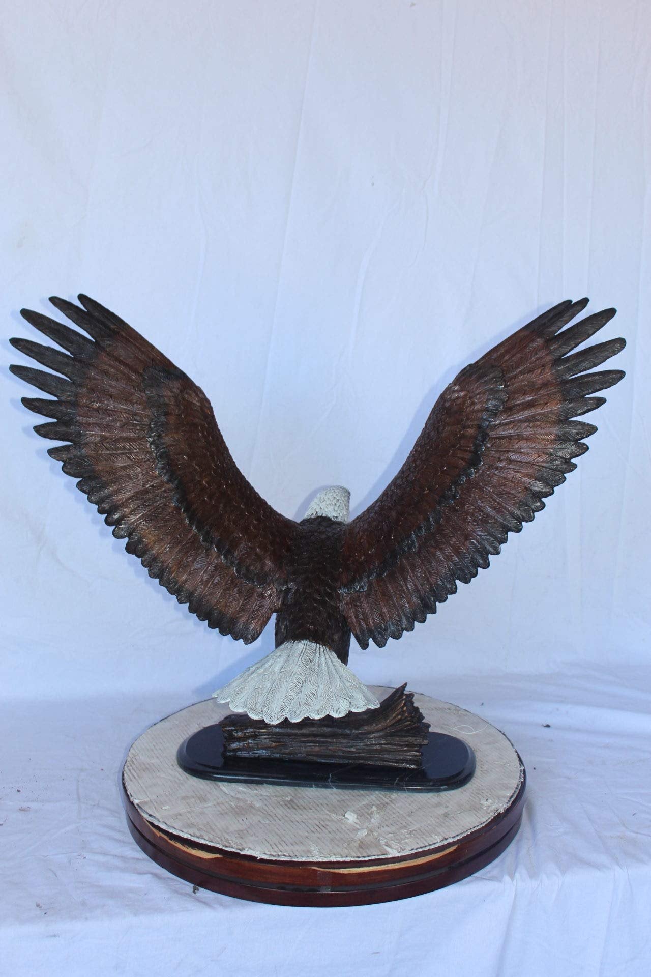 Perched eagle bronze statue -  Size: 35"L x 21"W x 29"H.