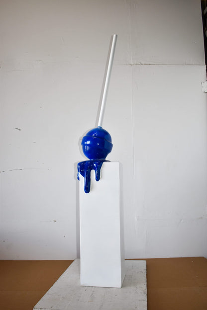 Blue Lollipop Mounted on A White Pedestal Resin Statue Size: 10" x 10" x 59"H