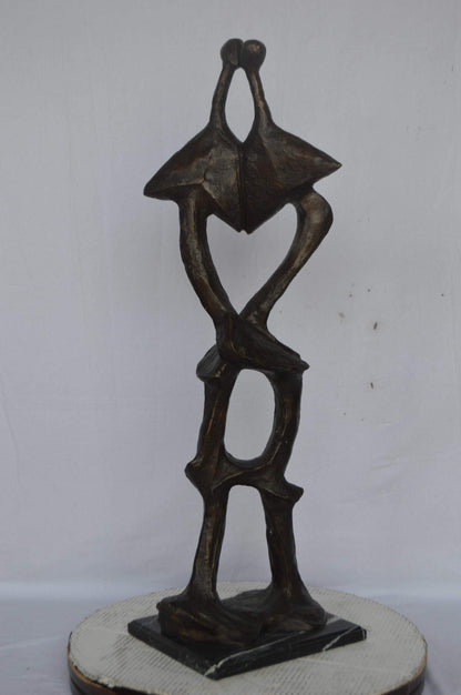 Modern art abstract, a couple kissing bronze statue - Size: 13"L x 11"W x 40"H.