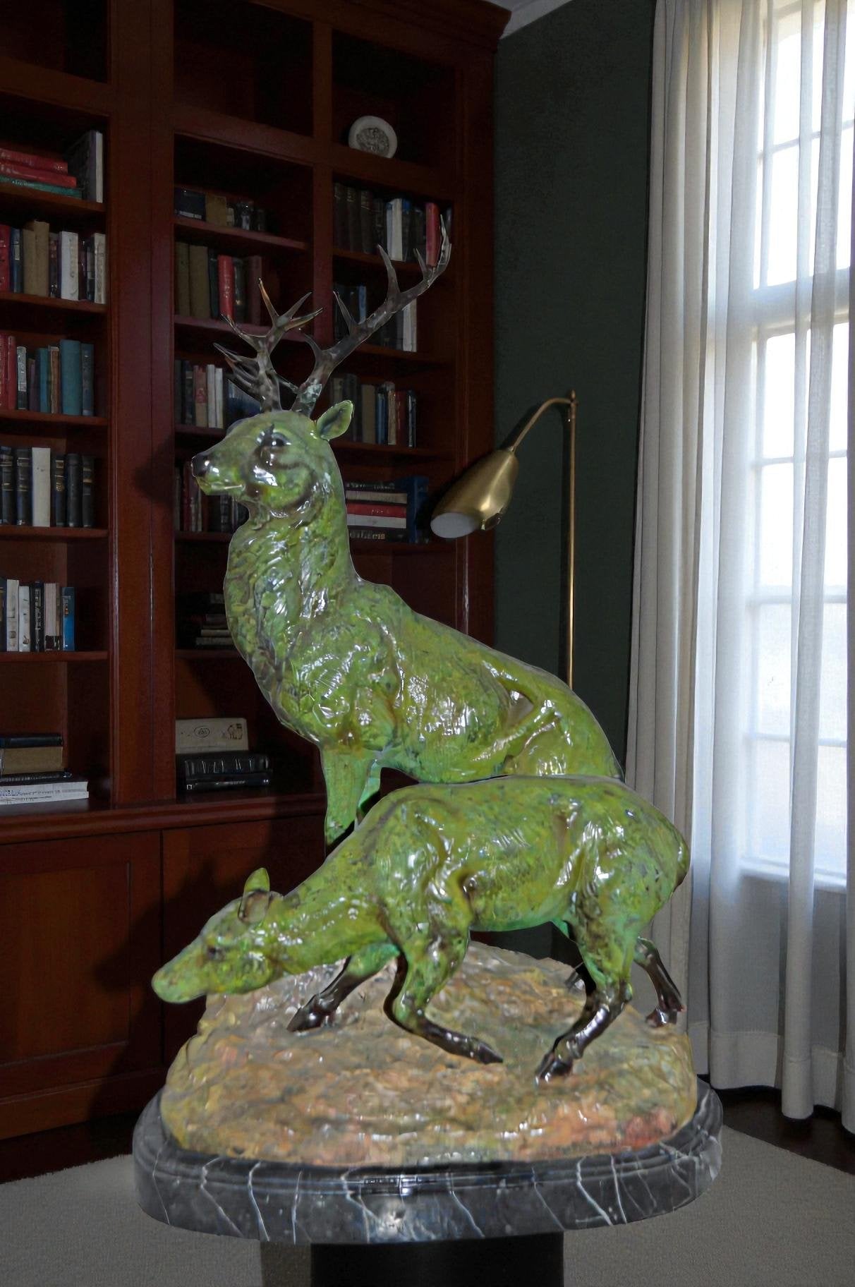 Two Deers Bronze Statue with a Green patina finish - Size: 15"L x 22"W x 32"H.