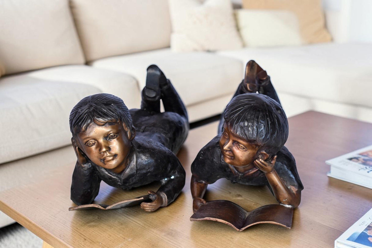 Young Kids Laying and Reading Cheerfully Bronze Statue Set Size: 20" x 13" x 8"H