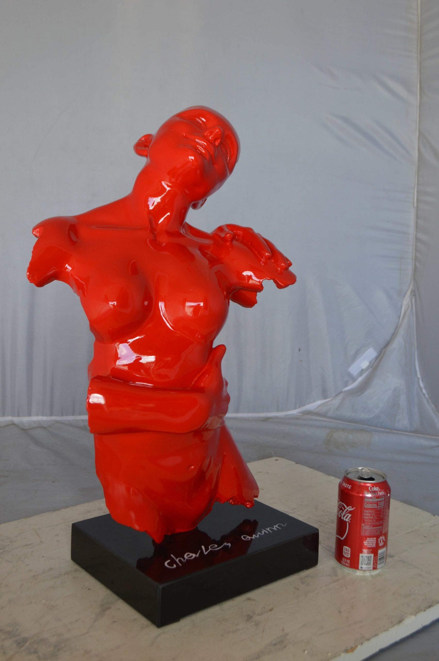 Modern resin statue of a woman hugged by a men -  Size: 13"L x 9"W x 24"H.