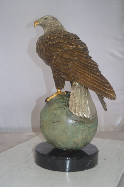 Bald Eagle Standing on a Globe Bronze Statue -  Size: 17"L x 9"W x 23"H.