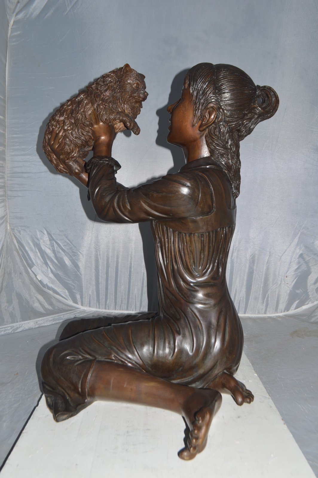 Girl Playing With Her Little Dog Bronze Statue -  Size: 22"L x 22"W x 30"H.