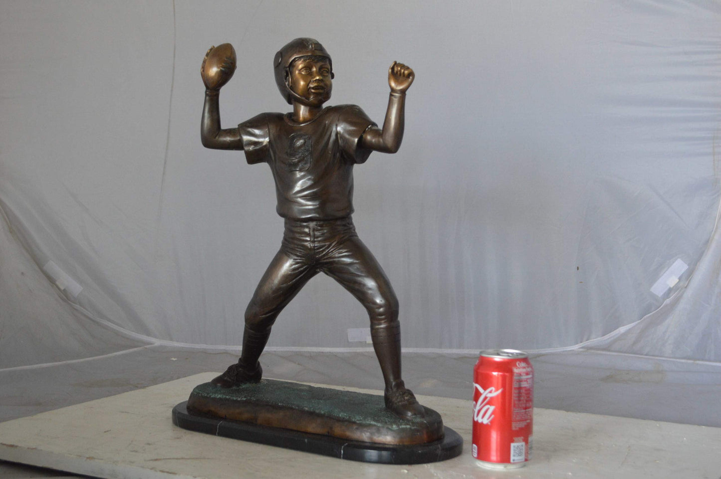Young Quarterback bronze statue - Size: 14"L x 6"W x 20"H.
