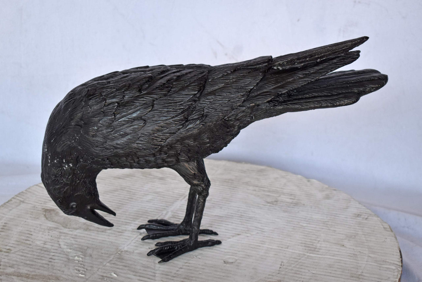 Raven Looking Down Bronze State - Size: 19"L x 5"W x 11"H.
