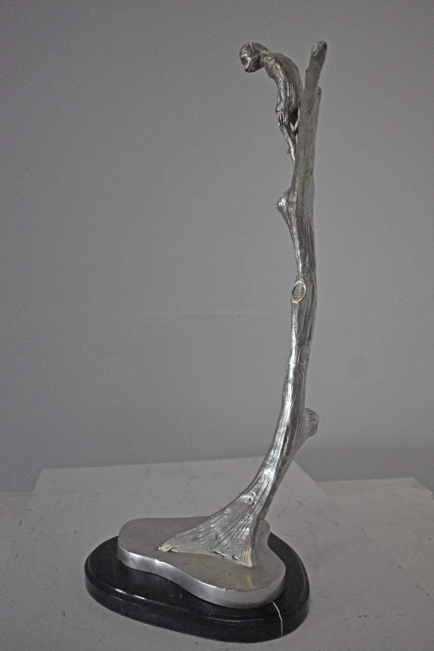 Monkey Resting on a Tree Silver Finish Bronze Statue - Size: 12" x 13" x 27"H.