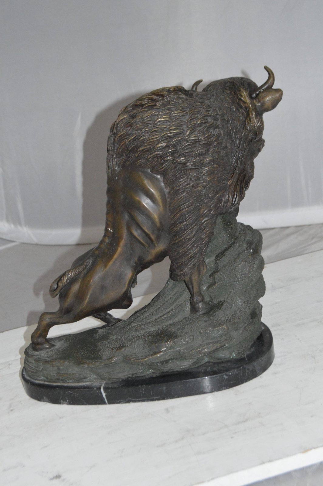 Bison Bronze Statue -  Size: 7"L x 14"W x 15"H.