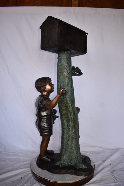 A Boy Standing by His Mailbox Looking at Birds Bronze Statue  25" x 22" x 51"H.