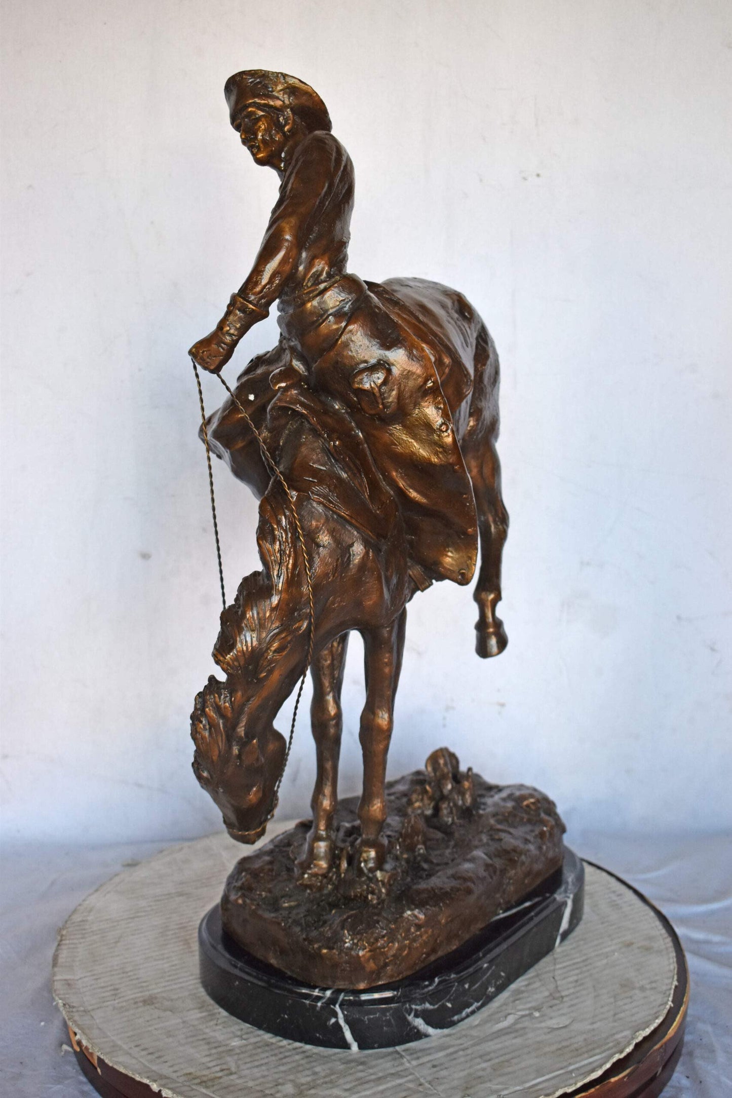 Outlaw by Remington Bronze Statue Replica - Size: 18"L x 10"W x 32"H.