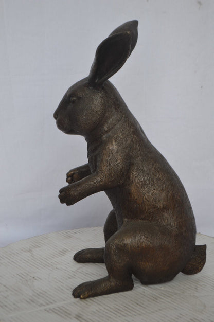 Rabbit looking down bronze statue - Size: 10"L x 12"W x 20"H.