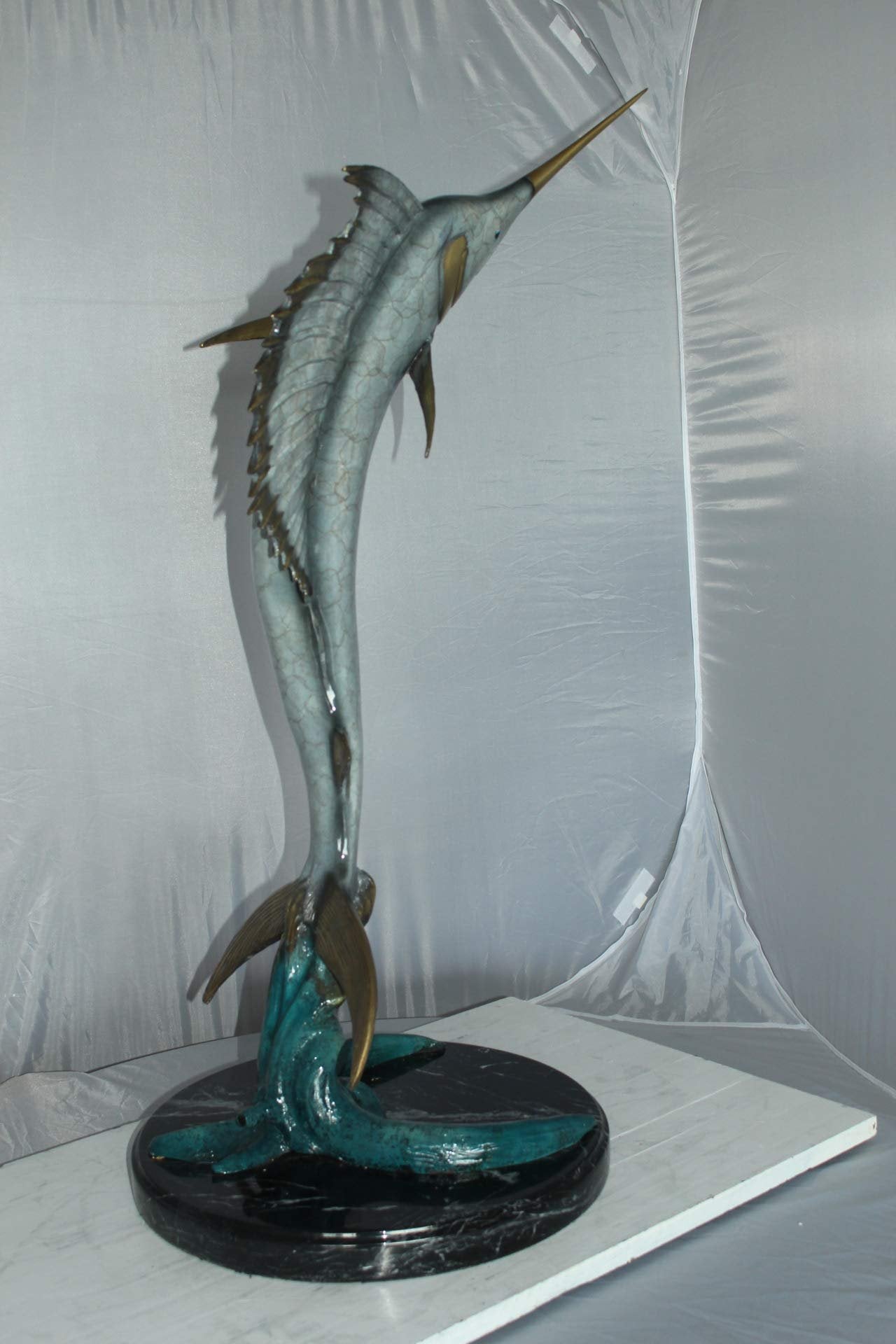 One Sailfish Jumping of the ware - Bronze Statue -  Size: 16"L x 16"W x 39"H.