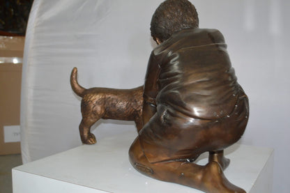 Boy and Dog Bronze Statue - Size: 30"L x 18"W x 18"H.