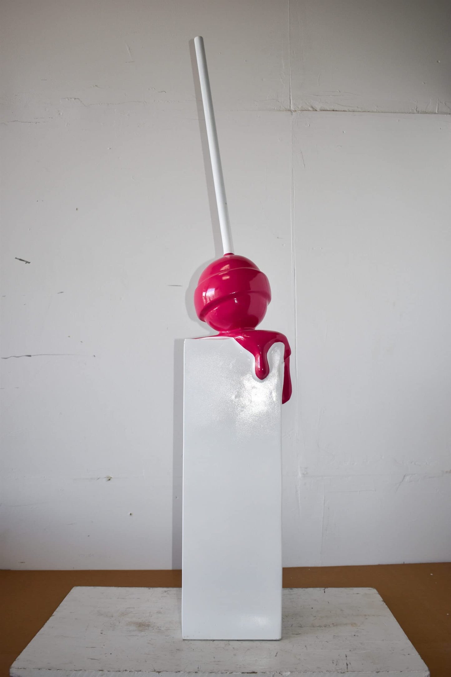 Red Lollipop Mounted on A White Pedestal Resin Statue Size: 10" x 10" x 59"H