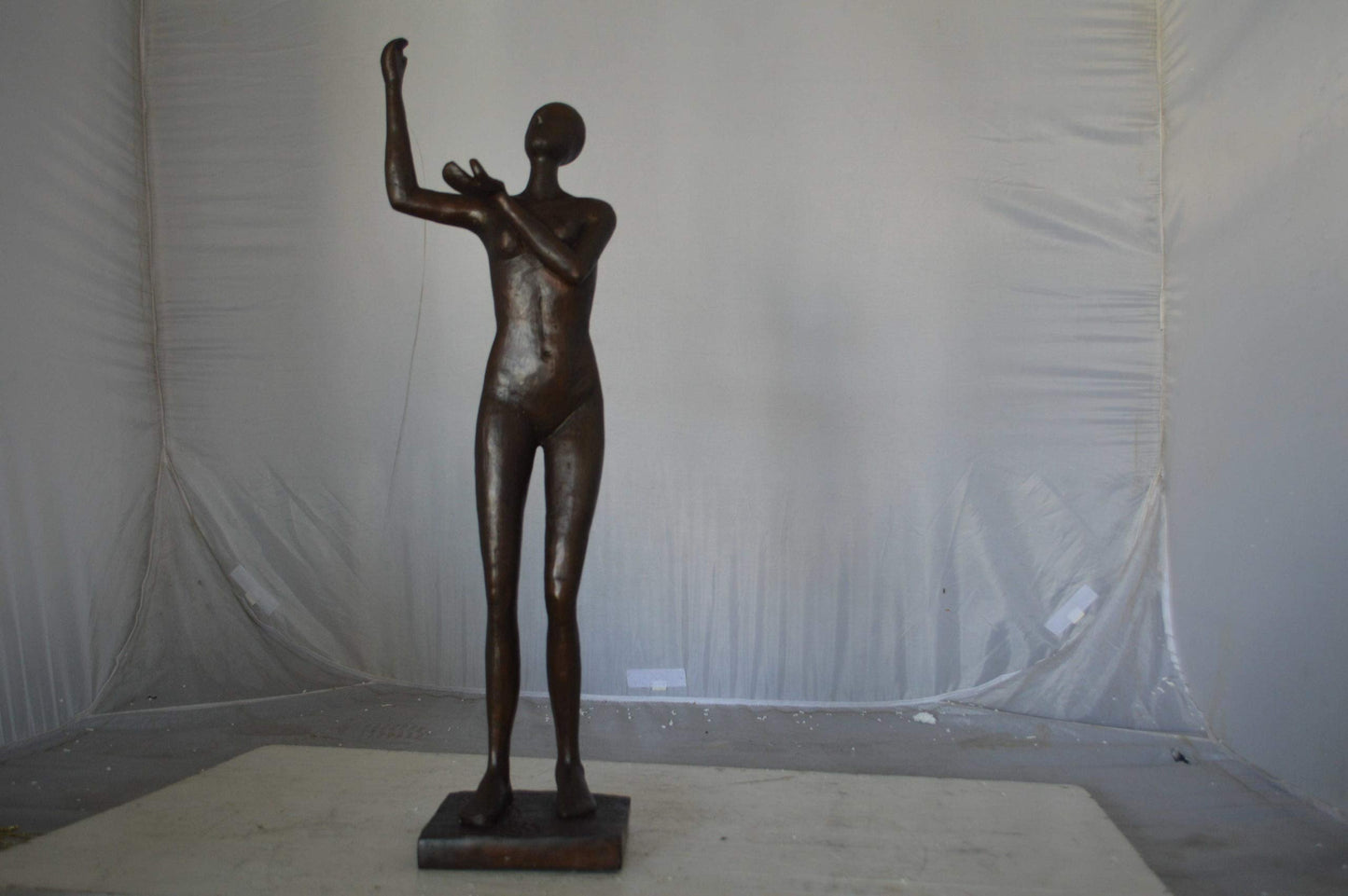 Abstract of Art nude lady lifting hand bronze statue - Size: 9"L x 6"W x 25"H.