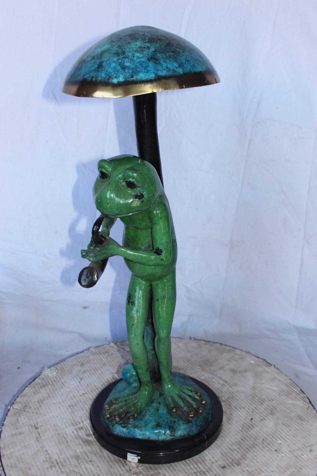 Jazzy frog perched under mushroom bronze statue   -  Size: 10"L x 10"W x 28"H.