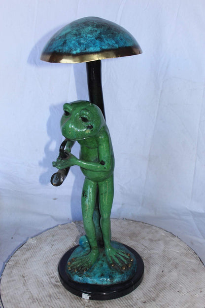 Jazzy frog perched under mushroom bronze statue   -  Size: 10"L x 10"W x 28"H.
